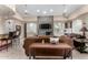Elegant living room features a stone fireplace, ceiling fans, and stylish furnishings at 29606 N Tatum Blvd # 121, Cave Creek, AZ 85331