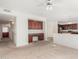 Bright living room features an integrated workspace with cabinets and a view of the modern kitchen at 29606 N Tatum Blvd # 121, Cave Creek, AZ 85331