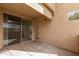 Covered patio with paver flooring and sliding glass door at 29606 N Tatum Blvd # 121, Cave Creek, AZ 85331