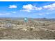Scenic aerial of vast landscape showcasing beautiful desert terrain and blue skies at 3144 W Maya Way, Phoenix, AZ 85083