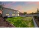 Large backyard with lush green grass and a patio, perfect for entertaining at 3144 W Maya Way, Phoenix, AZ 85083
