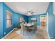 Bright dining room with seating for six, modern lighting, and a stylish rug at 3144 W Maya Way, Phoenix, AZ 85083
