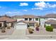Two-story home with a two-car garage, tiled roof, and well-maintained landscaping at 3144 W Maya Way, Phoenix, AZ 85083