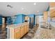 Open concept kitchen with granite island, stainless appliances, and tile flooring at 3144 W Maya Way, Phoenix, AZ 85083