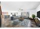Spacious living room with an open floor plan, modern furnishings, and plenty of natural light at 3144 W Maya Way, Phoenix, AZ 85083