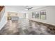 Open-concept living room with updated floors, neutral walls, and natural light from large windows at 3144 W Maya Way, Phoenix, AZ 85083