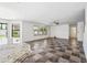 Expansive living room with tile floors and natural light from large windows at 3144 W Maya Way, Phoenix, AZ 85083