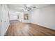 Cozy living room with neutral walls, modern wood flooring, and a ceiling fan at 3144 W Maya Way, Phoenix, AZ 85083