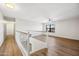 Upstairs loft featuring wood floors, a ceiling fan, and natural light at 3144 W Maya Way, Phoenix, AZ 85083