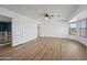 Large main bedroom with natural light, wood floors, and a walk-in closet at 3144 W Maya Way, Phoenix, AZ 85083