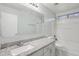 Bathroom featuring granite countertop, shower-tub, and ample lighting at 325 W Angus Rd, San Tan Valley, AZ 85143