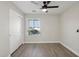 Light-filled bedroom with a large window, ceiling fan and closet at 325 W Angus Rd, San Tan Valley, AZ 85143