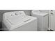 Laundry room with white washing machine and dryer at 325 W Angus Rd, San Tan Valley, AZ 85143