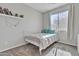 This bedroom features a white metal frame bed, carpeted floors, and natural light at 3419 E Rosa Ln, Gilbert, AZ 85297