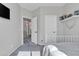 This bedroom features a white metal frame bed, carpeted floors, and natural light at 3419 E Rosa Ln, Gilbert, AZ 85297