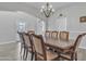 Formal dining room with ample seating for gatherings and a view to the outside at 3419 E Rosa Ln, Gilbert, AZ 85297