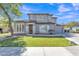 Charming two-story home featuring a well-manicured lawn and a neutral-toned exterior with stone accents at 3419 E Rosa Ln, Gilbert, AZ 85297