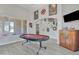 Entertainment room with a poker table, TV, and decorative wall art at 3419 E Rosa Ln, Gilbert, AZ 85297