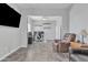 Open concept living room, showcasing a spacious area with tiled floors, ceiling fan, and gray walls at 3419 E Rosa Ln, Gilbert, AZ 85297