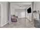 Spacious living room with tiled flooring, a ceiling fan, ample natural light and neutral-toned walls at 3419 E Rosa Ln, Gilbert, AZ 85297