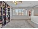 Bright loft space offering versatility and natural light, with carpet flooring and neutral walls at 3419 E Rosa Ln, Gilbert, AZ 85297