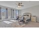 Serene primary bedroom featuring a cozy rug, ceiling fan, and plenty of natural light at 3419 E Rosa Ln, Gilbert, AZ 85297