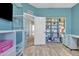 This office features plenty of storage on the side, and is adjacent to another room behind a white door at 3419 E Rosa Ln, Gilbert, AZ 85297