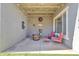 Inviting covered patio with outdoor seating, stylish decor, and a cozy ambiance for relaxation and enjoyment at 3419 E Rosa Ln, Gilbert, AZ 85297