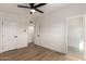 Bright bedroom with wood-look flooring and ensuite bathroom entrances at 3939 E Sahuaro Dr, Phoenix, AZ 85028