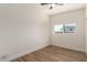 Bright bedroom with a window and wood-look flooring at 3939 E Sahuaro Dr, Phoenix, AZ 85028