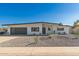 Charming single-story home featuring a modern design with gravel landscaping and a gray accent garage door at 3939 E Sahuaro Dr, Phoenix, AZ 85028