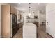 Bright kitchen with quartz island, stainless appliances, sleek cabinetry, and an open layout for easy entertaining at 3939 E Sahuaro Dr, Phoenix, AZ 85028