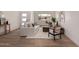 Bright and airy living room showcases neutral decor, wood flooring, and a welcoming atmosphere at 3939 E Sahuaro Dr, Phoenix, AZ 85028