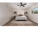 Bright main bedroom with neutral decor, wood floors, and ample space at 3939 E Sahuaro Dr, Phoenix, AZ 85028