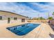 Backyard pool featuring cool, clear water, concrete edging, and patio, providing a serene outdoor retreat at 3939 E Sahuaro Dr, Phoenix, AZ 85028