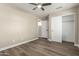 Cozy bedroom features a ceiling fan, closet, and ensuite bathroom access for added convenience at 399 W Buena Vista Dr, Tempe, AZ 85284