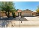 Charming single-story home with a neutral color scheme, desert landscaping, and a two-car garage at 399 W Buena Vista Dr, Tempe, AZ 85284