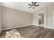 Primary bedroom featuring a ceiling fan and ensuite bath at 399 W Buena Vista Dr, Tempe, AZ 85284
