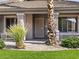 Inviting front porch with desert landscaping and a decorative front door at 42476 W Chisholm Dr, Maricopa, AZ 85138