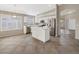 Spacious kitchen with stainless steel appliances and a center island at 42476 W Chisholm Dr, Maricopa, AZ 85138