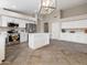 Bright kitchen with stainless steel appliances and a center island at 42476 W Chisholm Dr, Maricopa, AZ 85138
