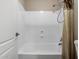Bright and clean bathroom shower featuring updated fixtures and tiled walls at 42476 W Chisholm Dr, Maricopa, AZ 85138