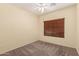 Bedroom featuring neutral carpet, yellow walls, and a ceiling fan at 44215 W Granite Dr, Maricopa, AZ 85139