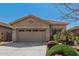 Inviting single-story home with a well-maintained front yard and attached two-car garage at 44215 W Granite Dr, Maricopa, AZ 85139