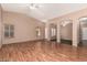 Spacious living room with hardwood floors, high ceilings, and abundant natural light at 44215 W Granite Dr, Maricopa, AZ 85139