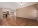 Open-concept living space with modern flooring, neutral walls, and access to the kitchen at 44215 W Granite Dr, Maricopa, AZ 85139