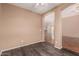 Inviting living space with hardwood floors, arches to other rooms, and neutral paint at 44215 W Granite Dr, Maricopa, AZ 85139