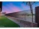 A modern metal fence enhances this backyard's privacy at 4606 S Ferric --, Mesa, AZ 85212