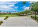 Community basketball court with lush lawns, mature trees, and beautiful residential homes in the background at 4606 S Ferric --, Mesa, AZ 85212