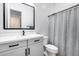 Modern bathroom featuring a stylish vanity, sleek fixtures, and a neutral-toned shower curtain at 4606 S Ferric --, Mesa, AZ 85212